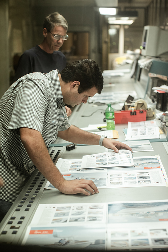 Victor comparing actual colors to the prints.