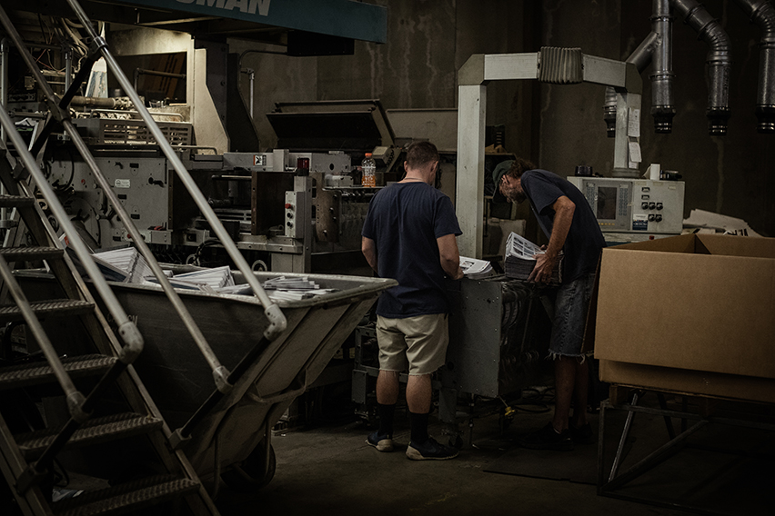 Here are the guys stacking copies at the end of the line.