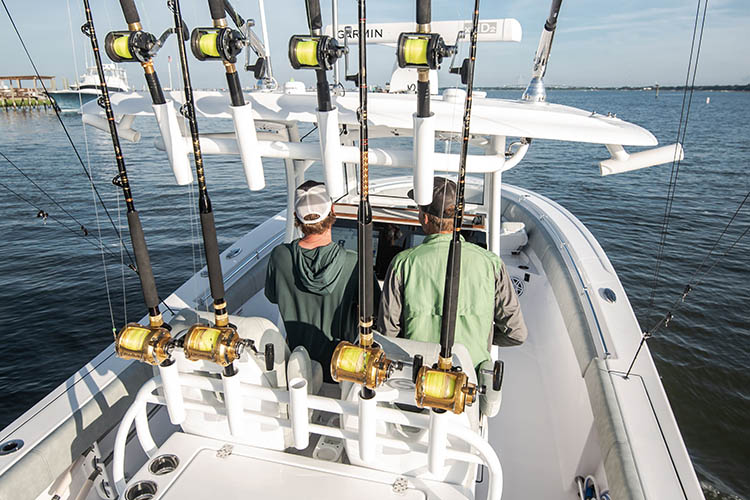 Picture of baitcasters in rod mounts on boat.