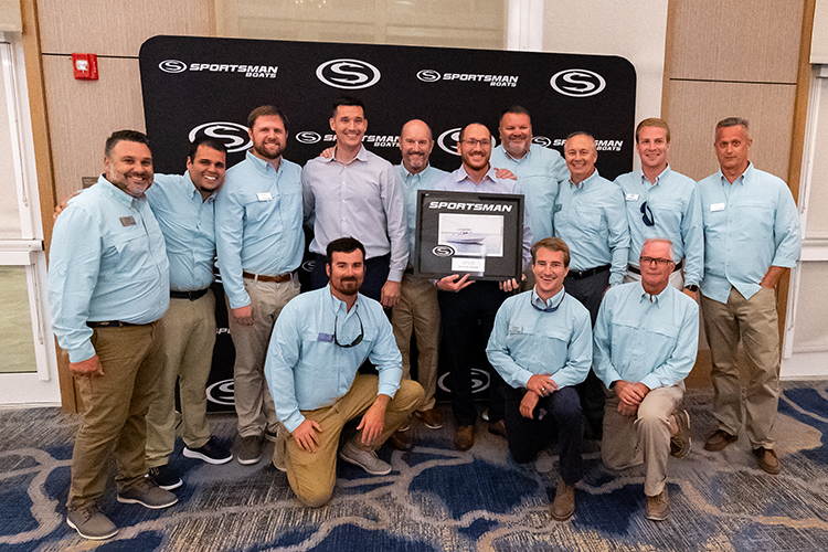 The Riverside Marine team receiving their top dealer award with the Sportsman executive team including Tommy Hancock, Russ Tomlinson, Richie Rodgers, Victor Gonzalez, Aaron Dumont and Bryan Greenwood.