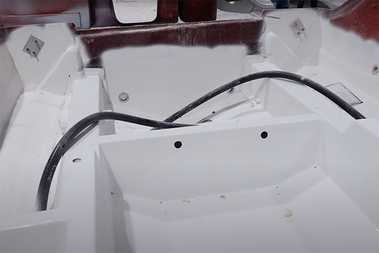 Image of the inside of a Sportsman Boat with a stringer in the hull.