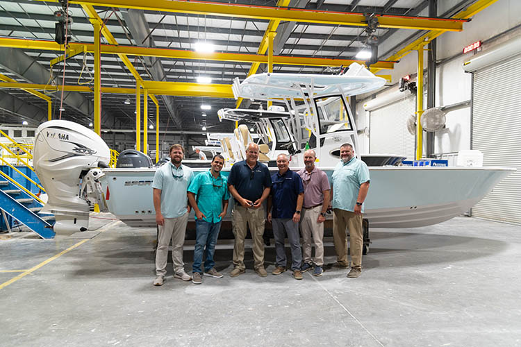 Group photo of the Sportsman exec team and the OneWater South Shore Marine group.