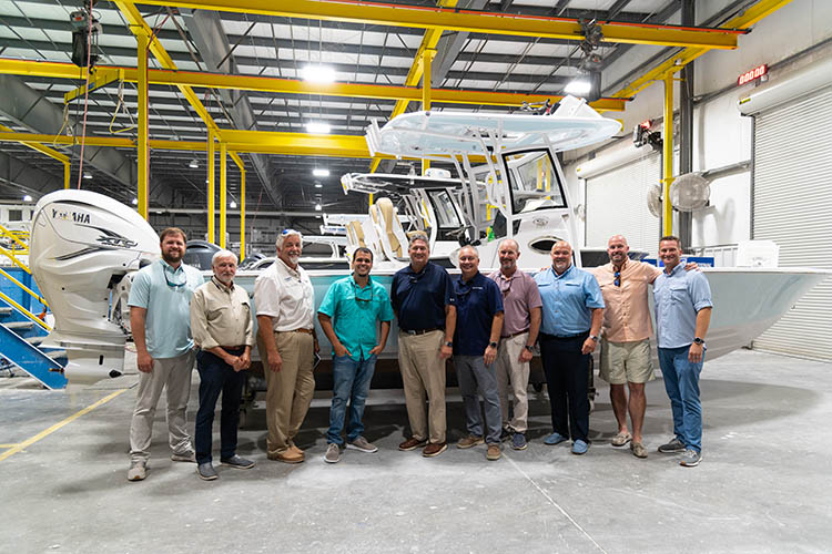 Group photo of the Sportsman exec team and the OneWater Legendary Marine group.