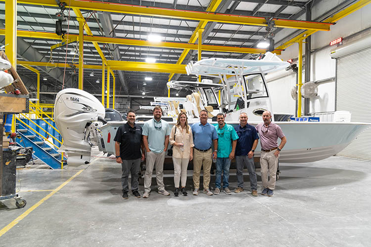 Group photo of the Sportsman exec team and the OneWater Sundance Marine group.