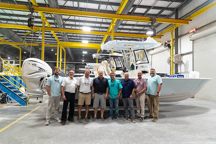 Group photo of the Sportsman exec team and the OneWater Bosun's Marine group.