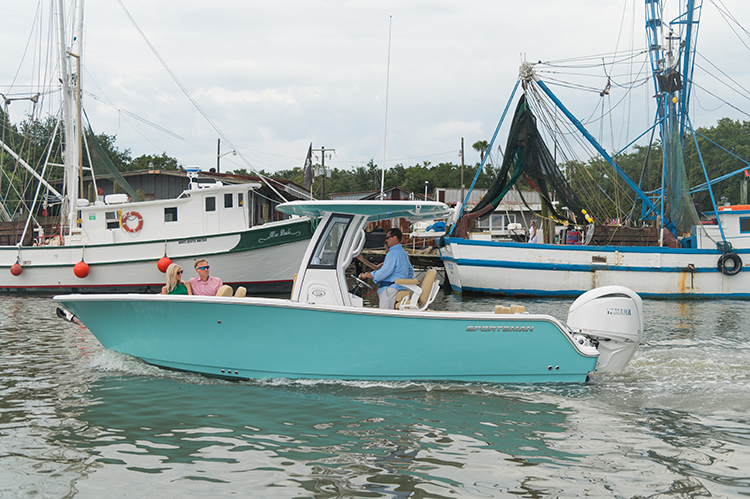 Photo of a boat cruising up Shem Creek