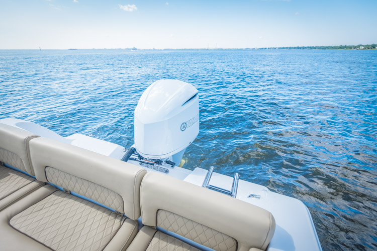 The brand new Sportsman Heritage 241 center console with a white custom painted Yamaha F300 outboard