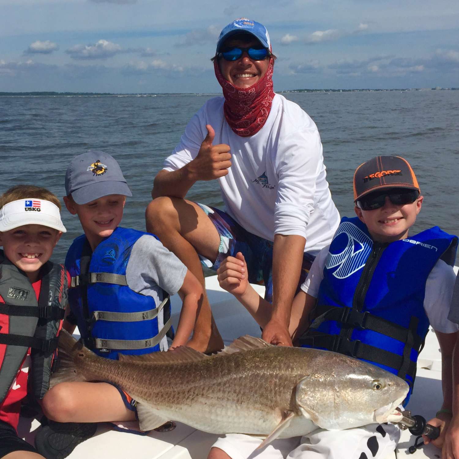 Young anglers with a bull redfish at Kiawah Island on the South Carolina coast with Captain Colt Harrison of Affinity...