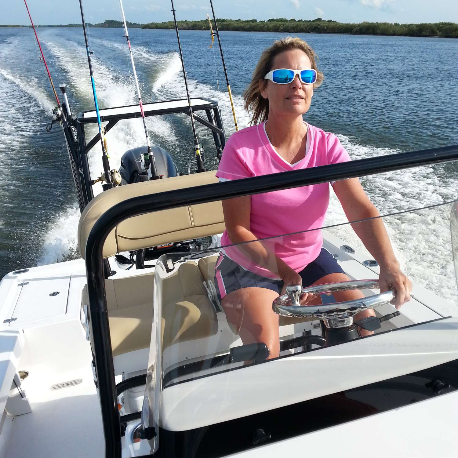 My photo was taken on the Halifax river Port Orange Florida, Lori enjoying her first time driving!