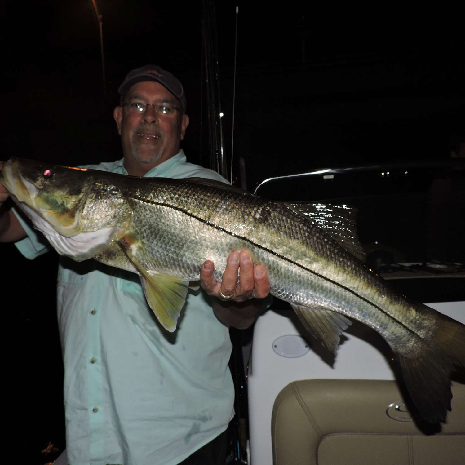 Todd with the first snook on the new boat a nice over slot snook in stuart fl