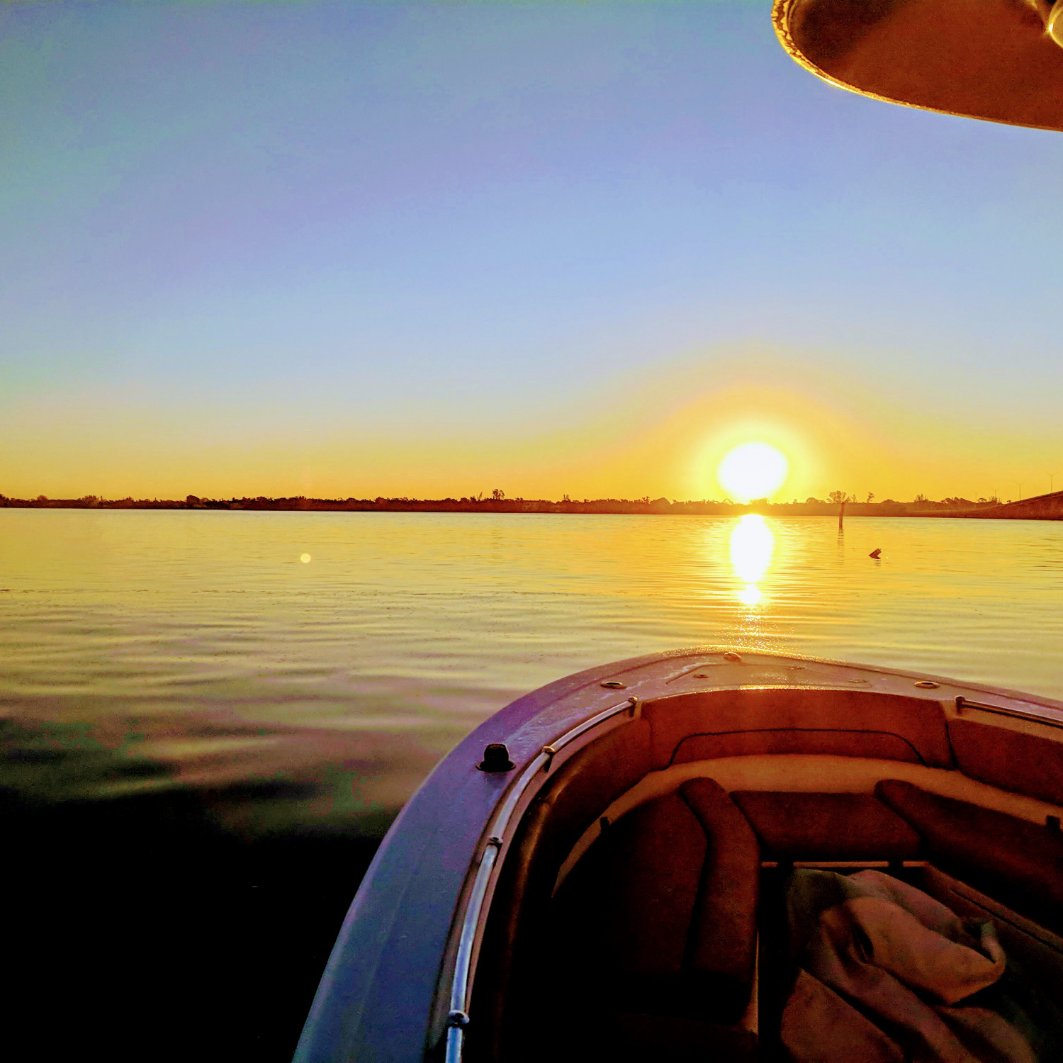 This photo is of us leaving the marina at sunrise for a day of fishing!!