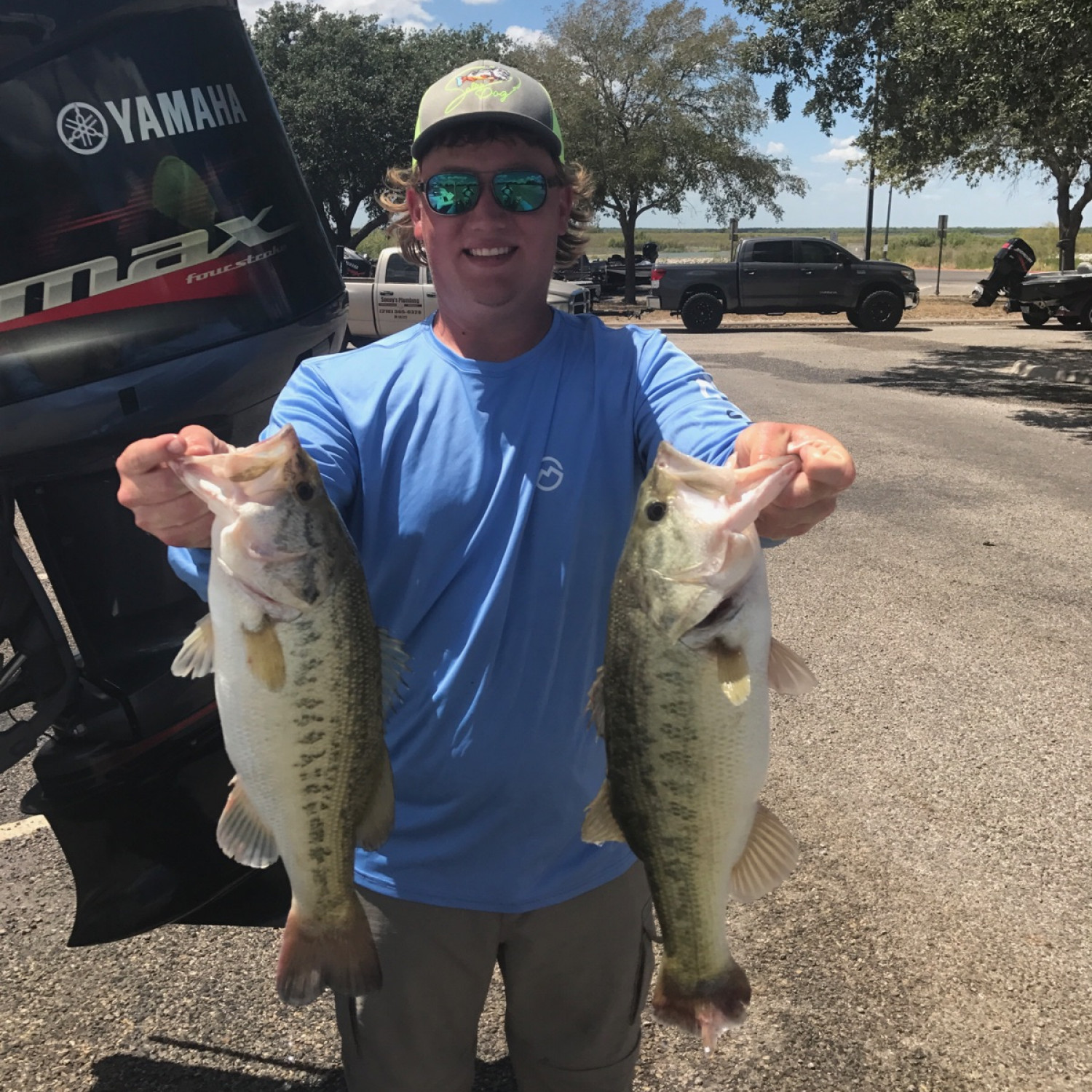 My son with 2 of his bass at tournament weigh in