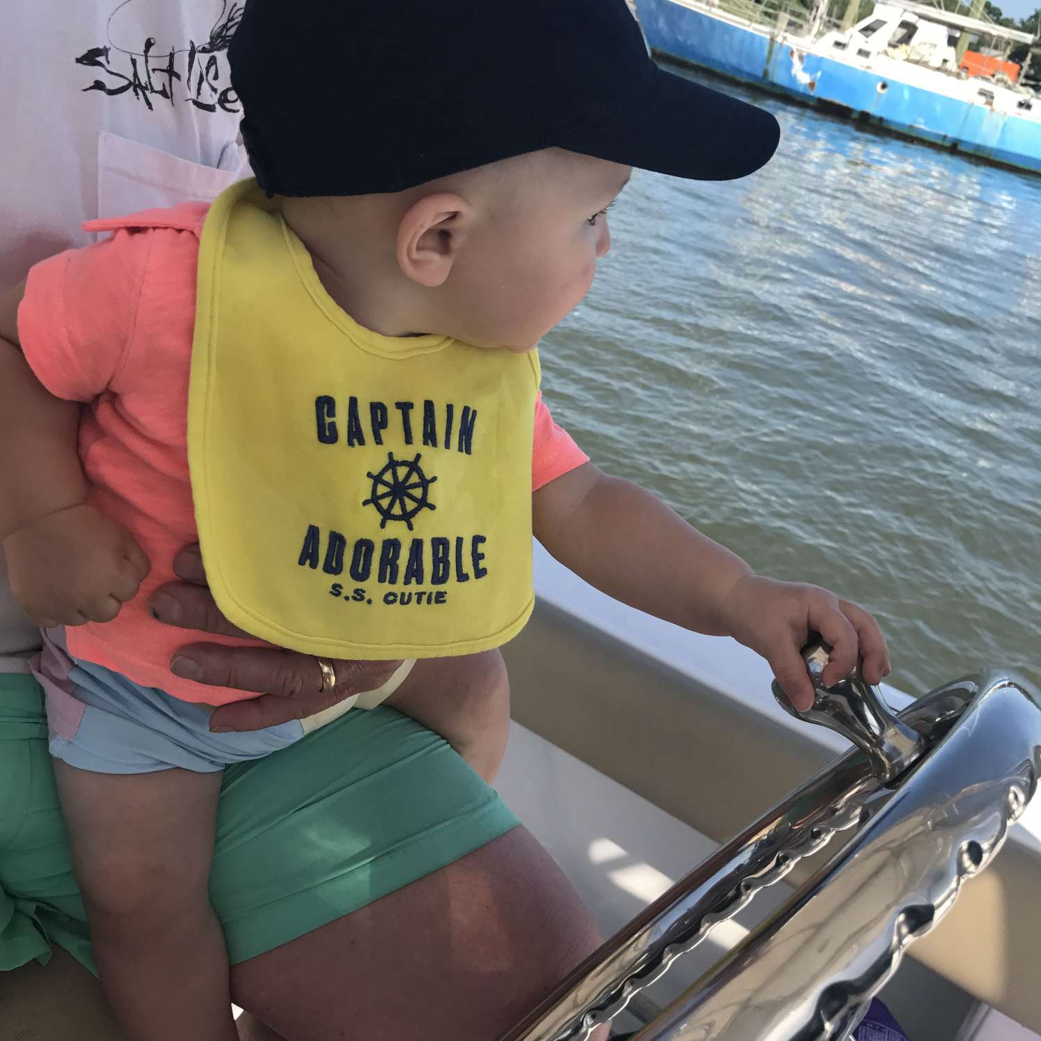 Baby Sawyer's (aka Captain Adorable) first boat ride! Needless to say, he loved it É at the helm of his...