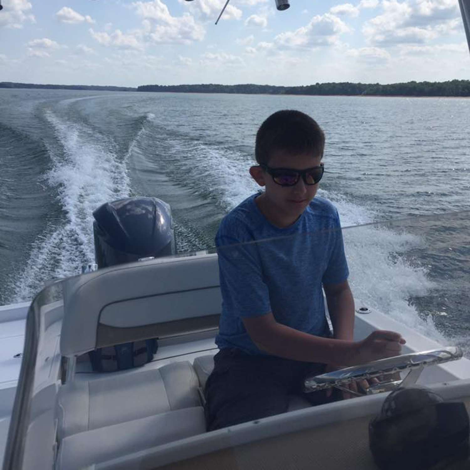 Photo taken on Lake Hartwell of my 12 year old son learning the ropes on our 2015 Sportsman Masters 247.