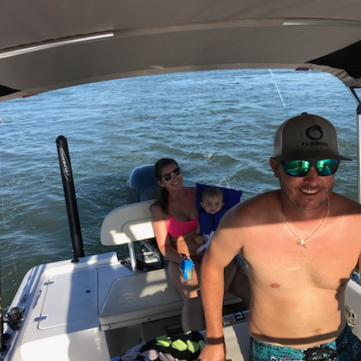 Schooley family enjoying a day fishing and swimming at the sandbar.