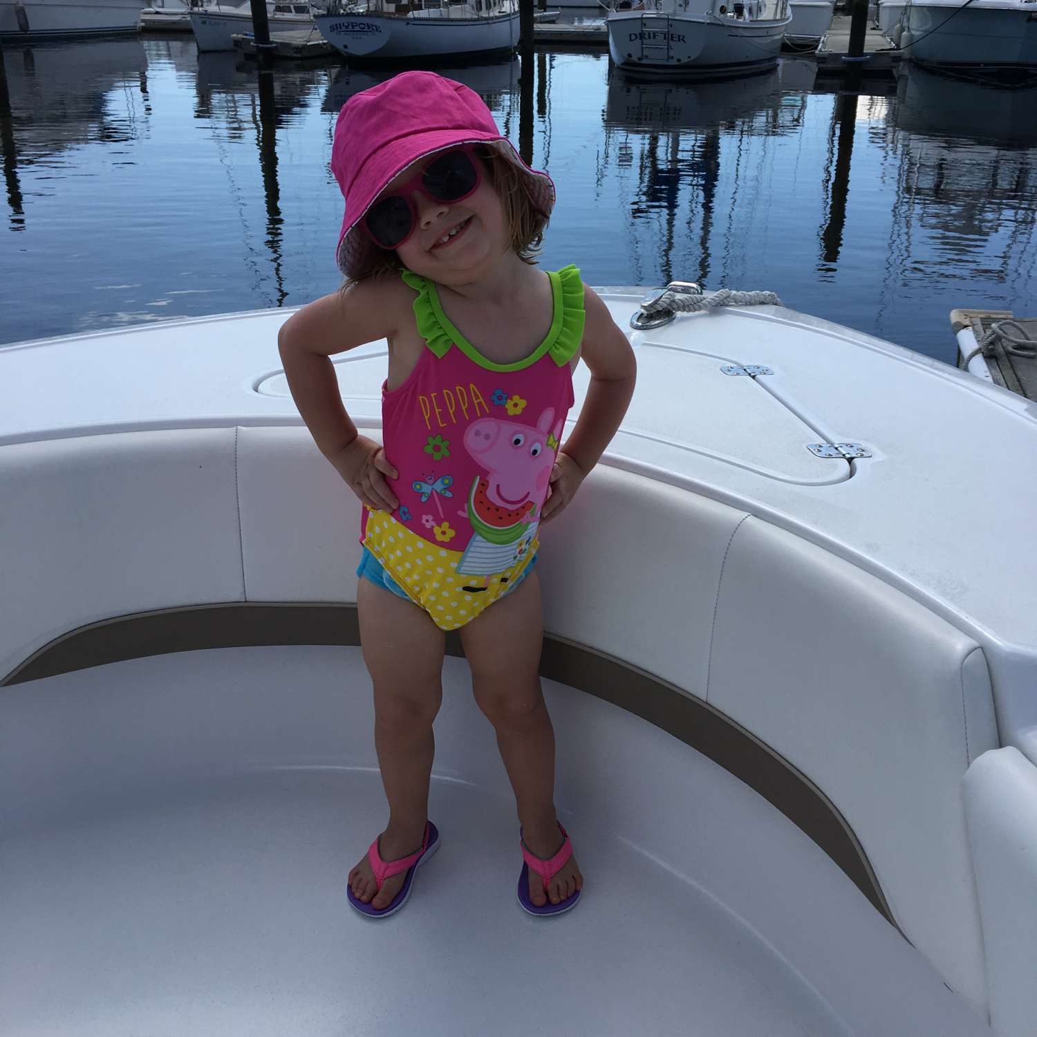 Our beautiful granddaughter on our boat at Palm Cove Marina