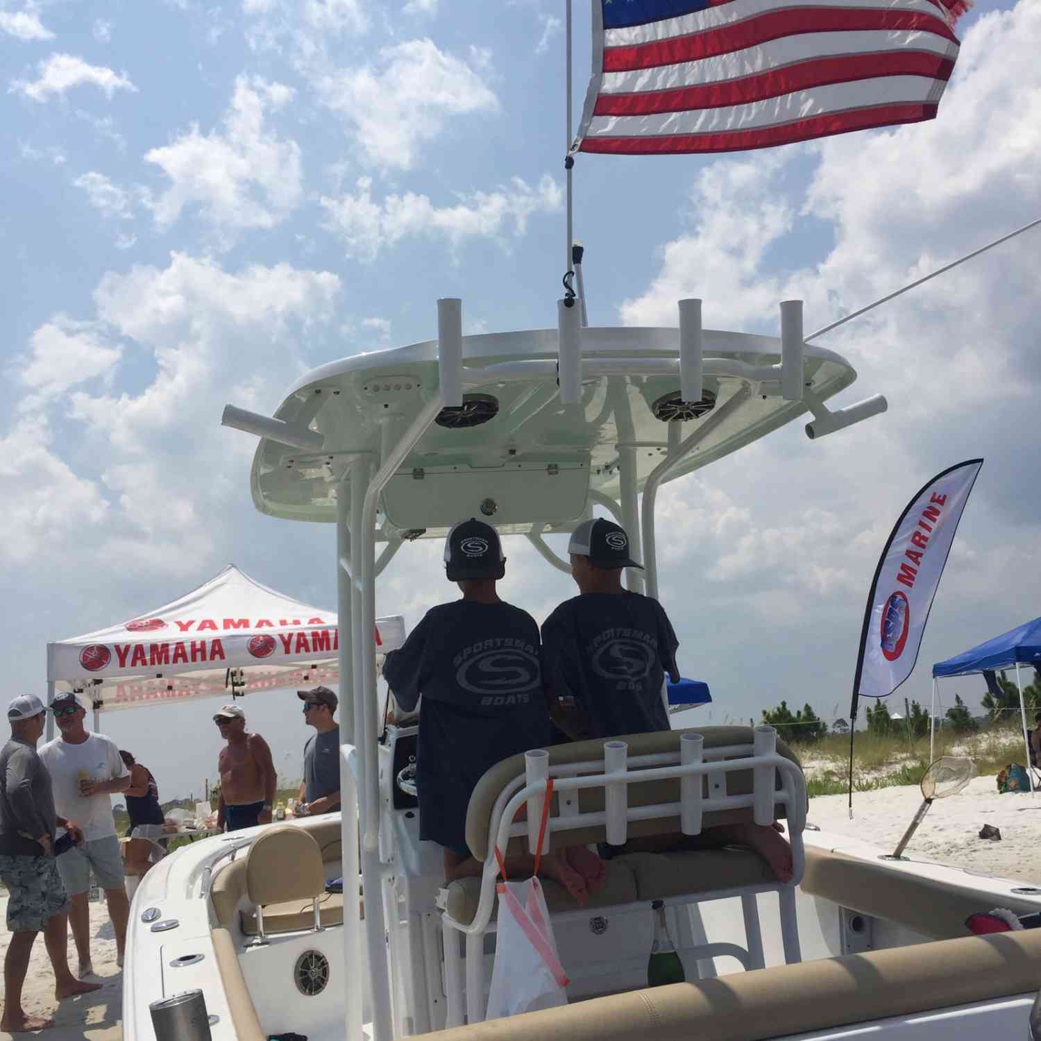 Our son and his buddy discussing the electronics in their Sportsman swag at the Orange Beach Sportsman Boat gathering.