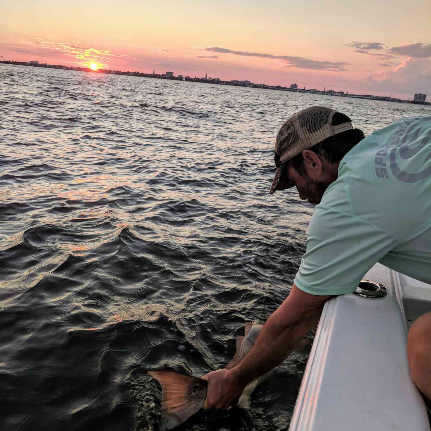 Releasing redfish caught in Charleston Harbor.