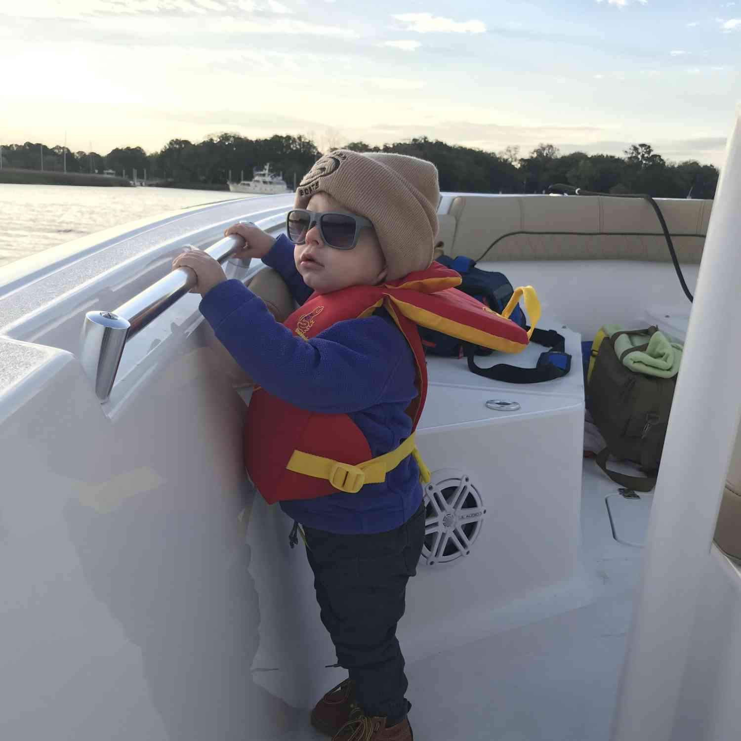 My son hanging on during his first ride on a Sportsman!