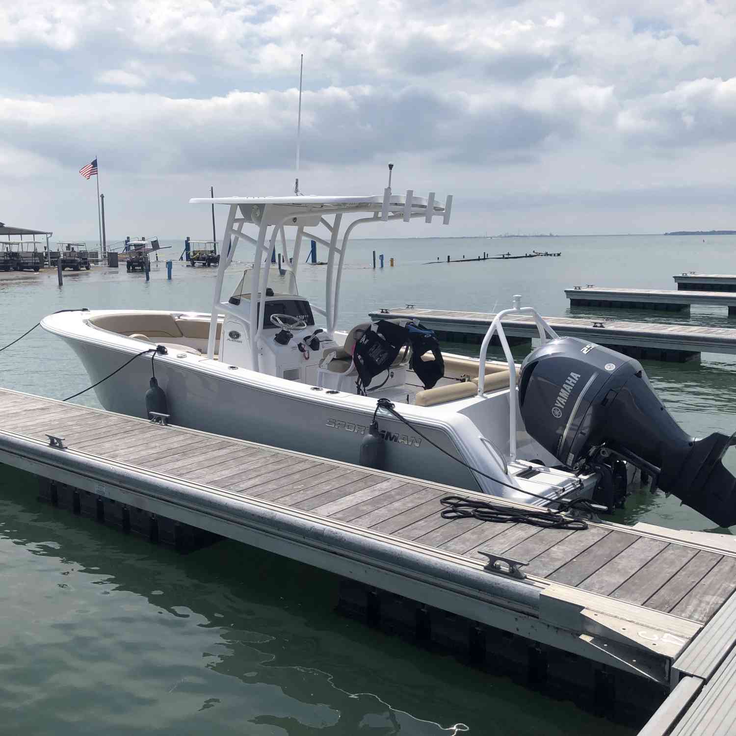 Feeling independent and proud after successfully taking our new 231 to island, and the dock matched our silver cloud hull...