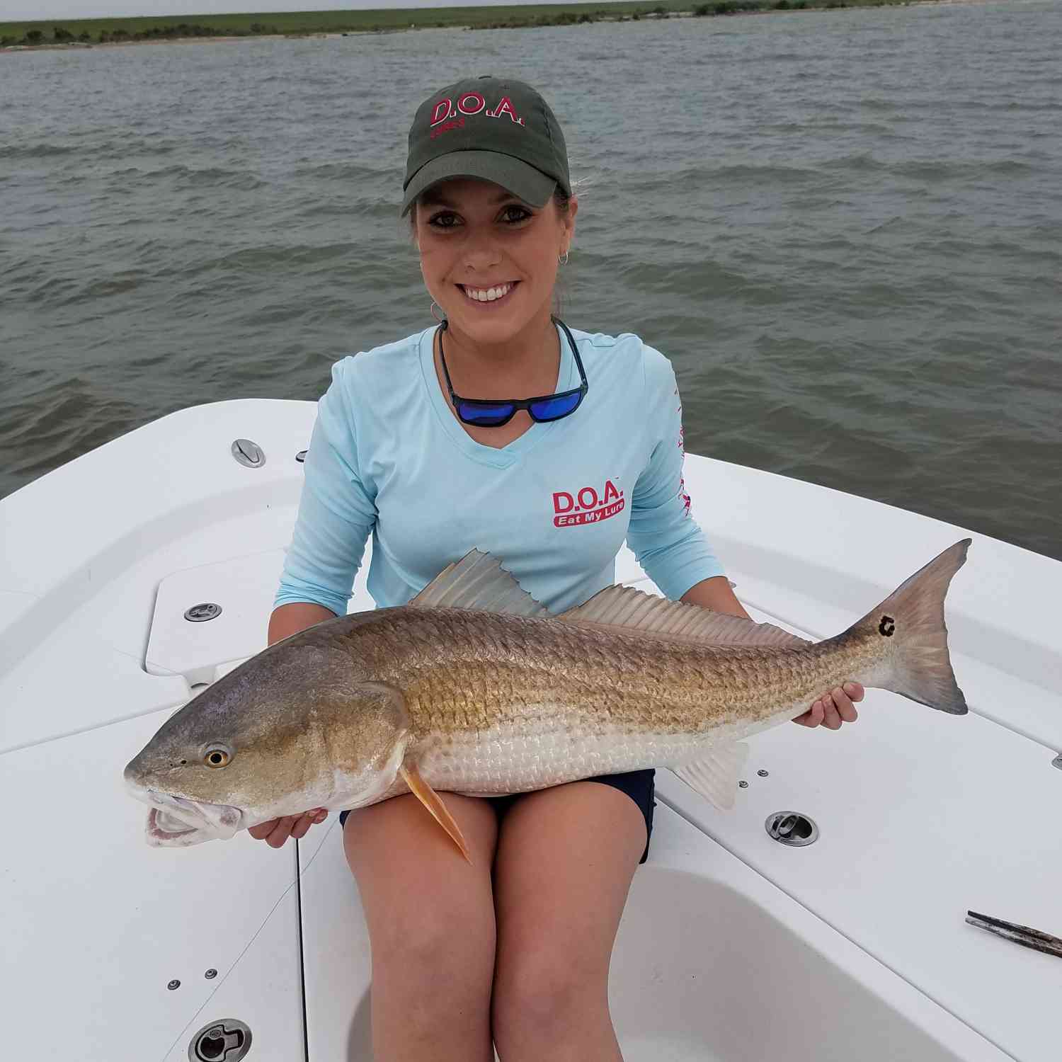 The blonde with a Cpr Redfish.