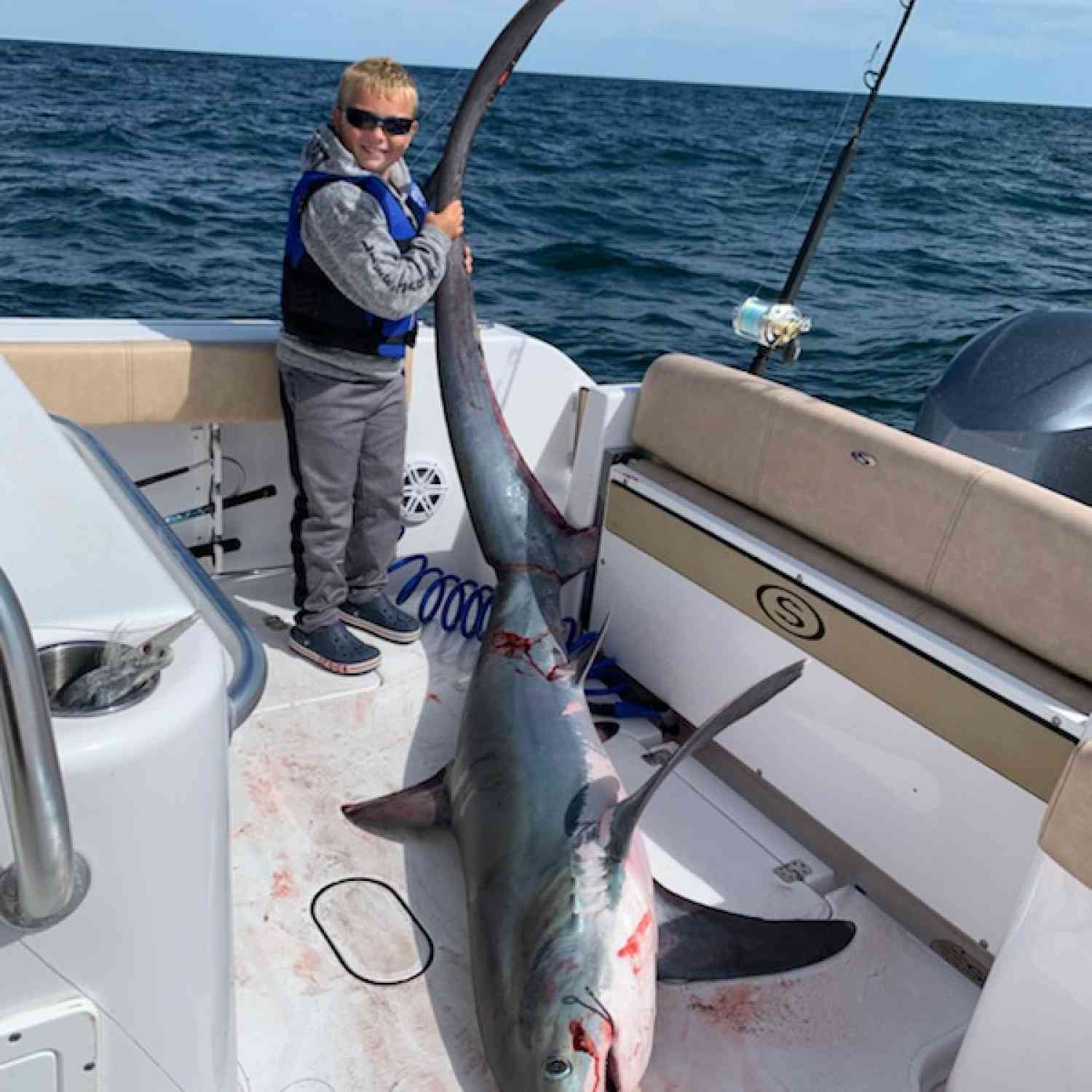 Nathan , 8 years old with a 180 lbs thresher shark. 10 miles south of Montauk point, on 312.