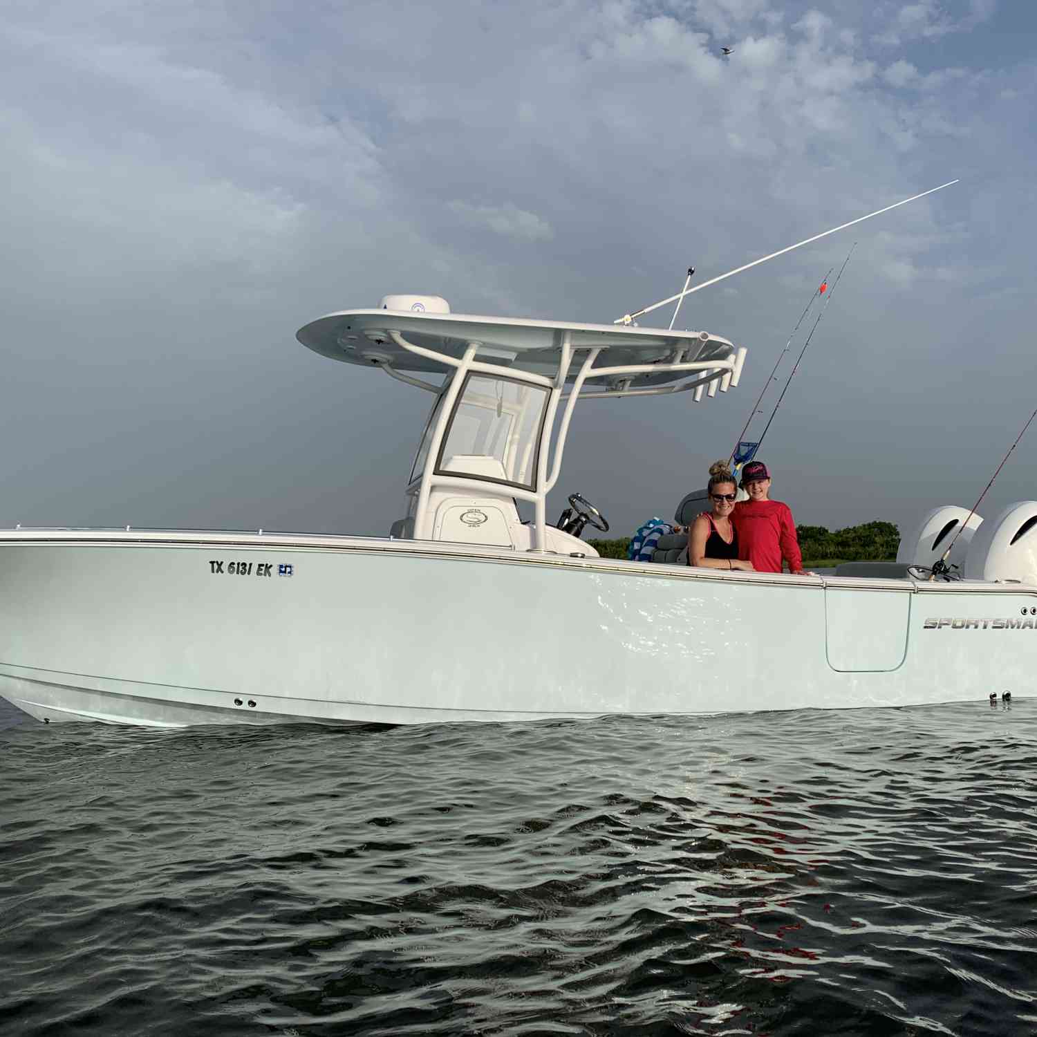 Daughter and granddaughter on family fishing trip in west bay of Galveston bay system