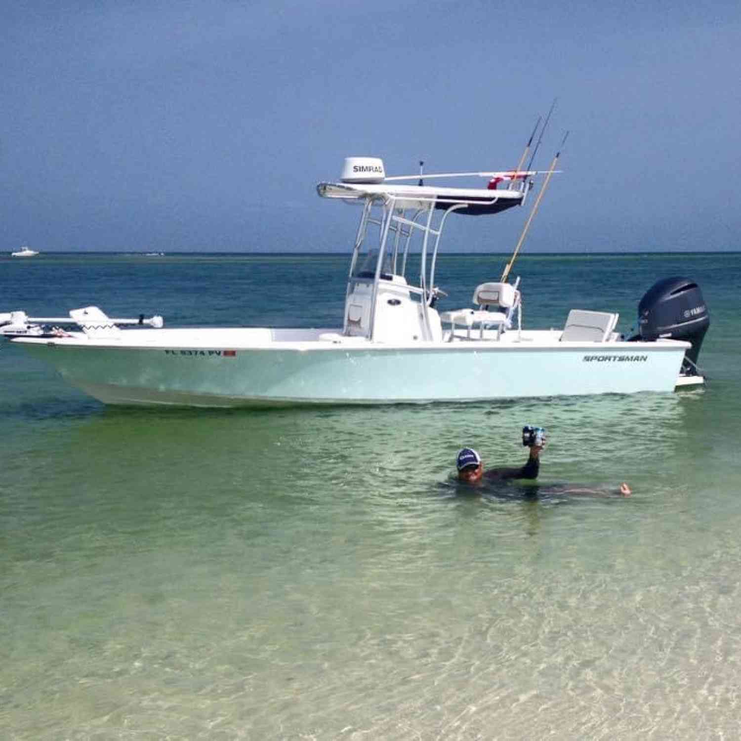 Sand bar day after loading up during mini season! Loving the beer, boat, and island life