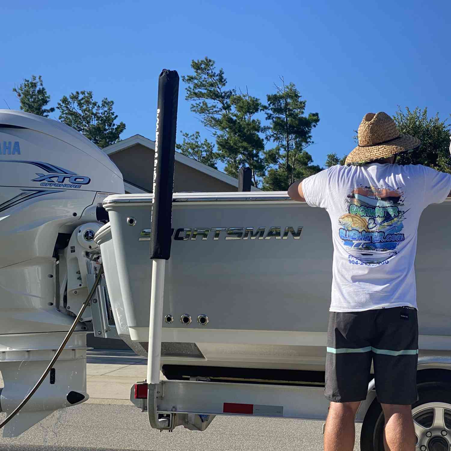 Just a man admiring his new boat.