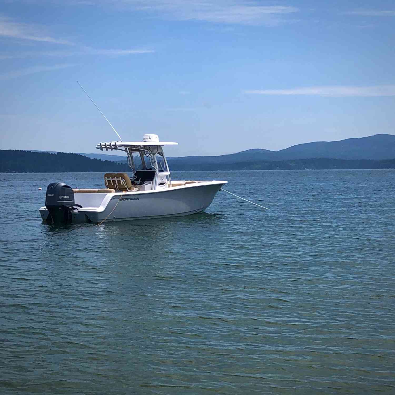 Anchored while enjoying the beach at Long Island.  Bartletts Island and MDI/Acadia National Park in the background.