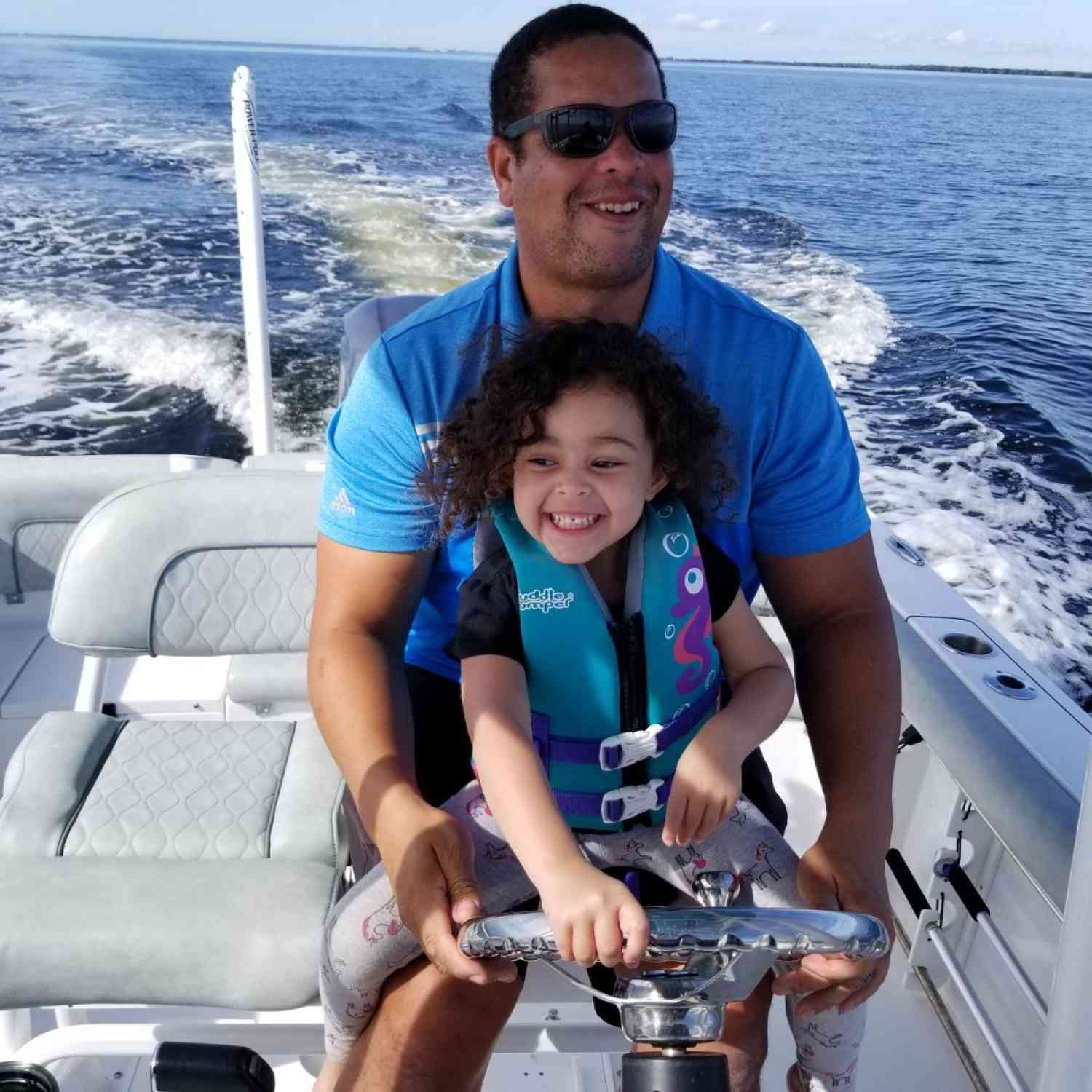 Me and my daughter Sienna Pearl aka BramBram.  Letting her take the helm on our way to Beer Can Island.