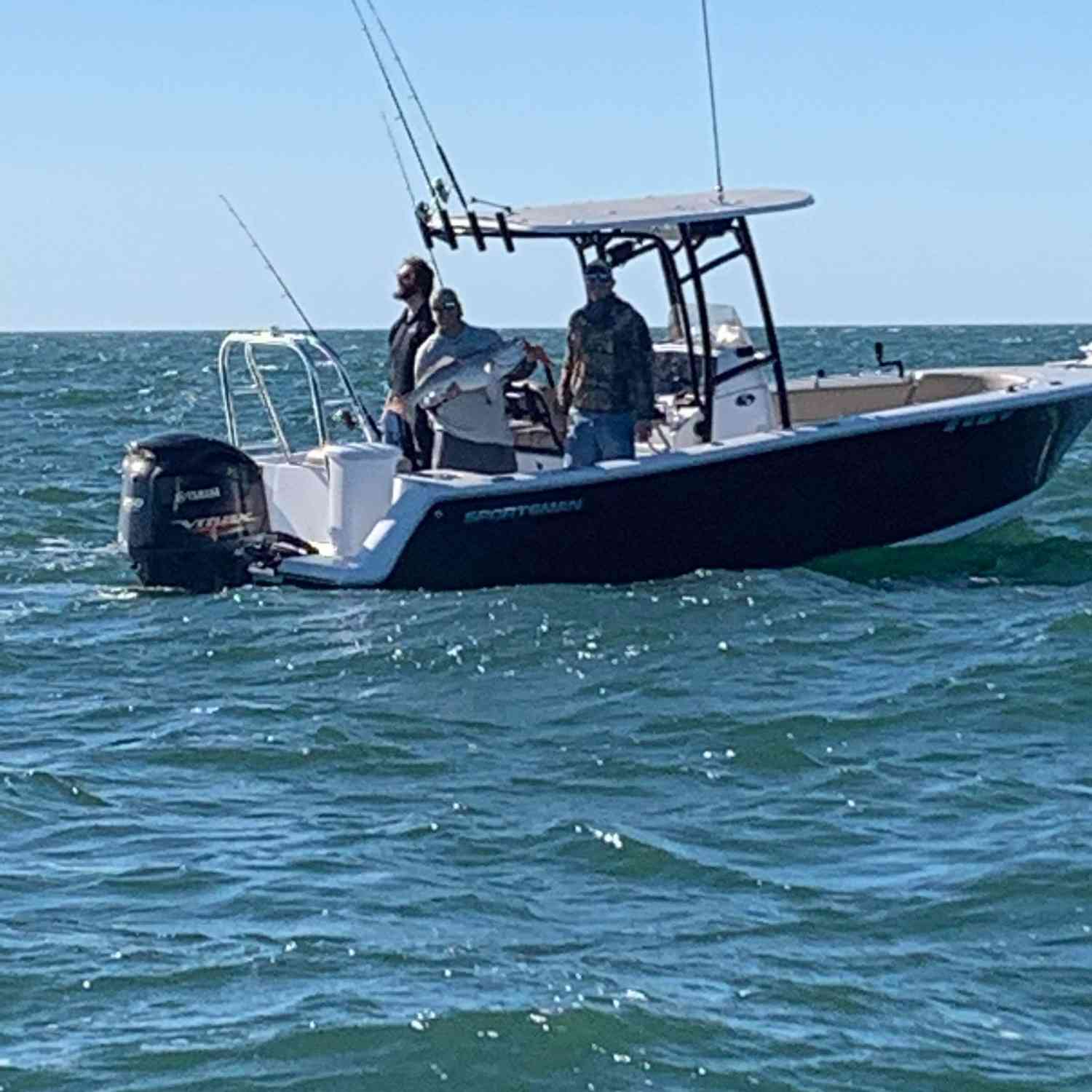 We were fishing and Bruce caught a monster red drum. Our buddy took the picture from another bo...