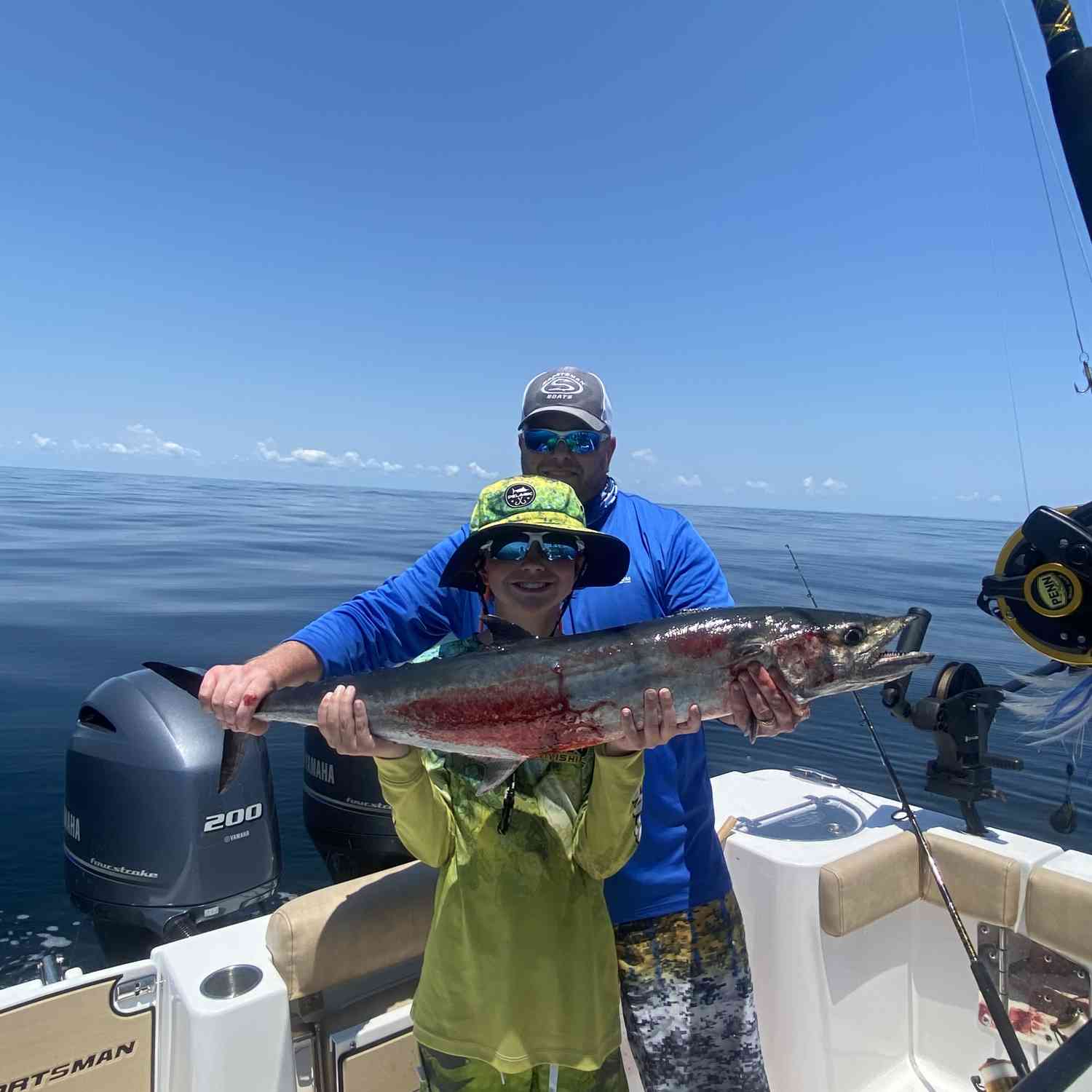 Beautiful Saturday offshore for catching some kings. This is our son, Kason with his first king!