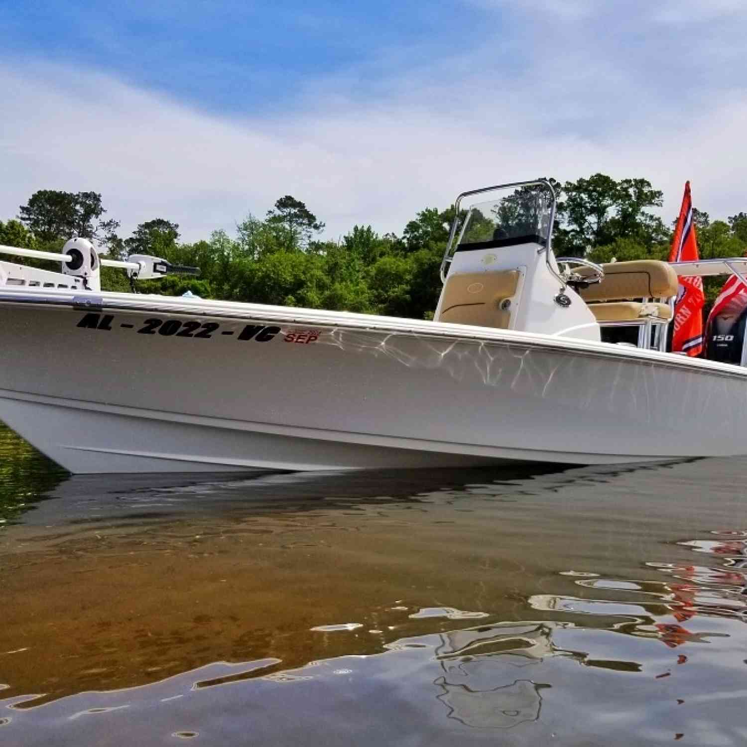 Sportsman Tournament 214 is staked out with the powerpoles in shallow water at the local sandbar.