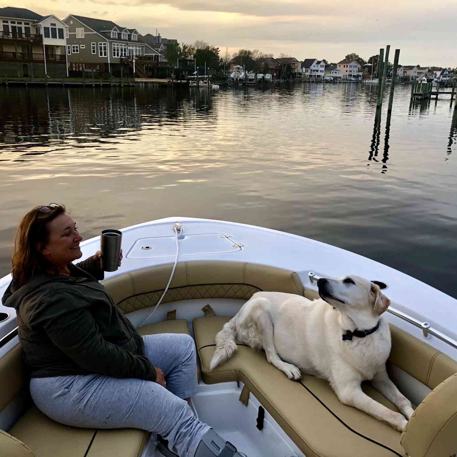 Susan and Zinny enjoying the calm waters from our very comfortable Sportsman Heritage 211.