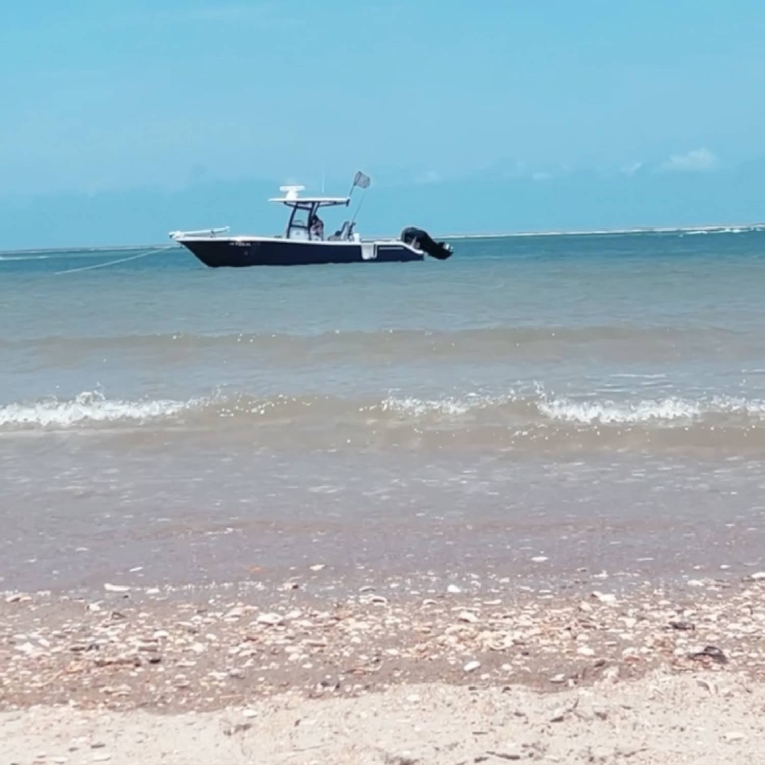 Title: Somewhere on a beach - On board their Sportsman Open 282TE Center Console - Location: Cape Lookout ,NC. Participating in the Photo Contest #SportsmanAugust2021