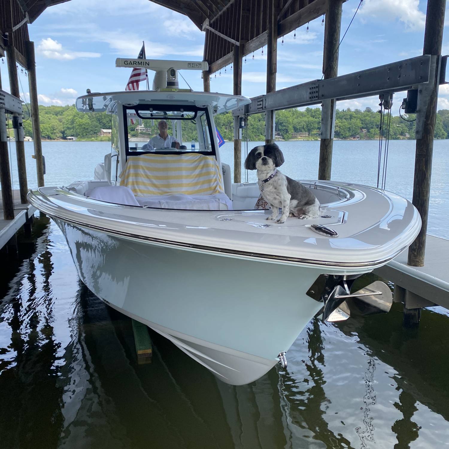 Title: Harley(shitzu) loves boat rides on the 352 - On board their Sportsman Open 352 Center Console - Location: Knoxville TN. Participating in the Photo Contest #SportsmanAugust2021