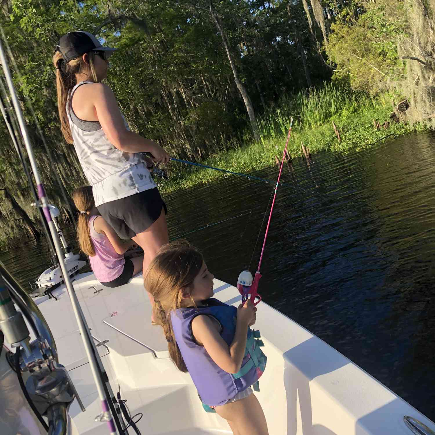 Mother and daughters fishing