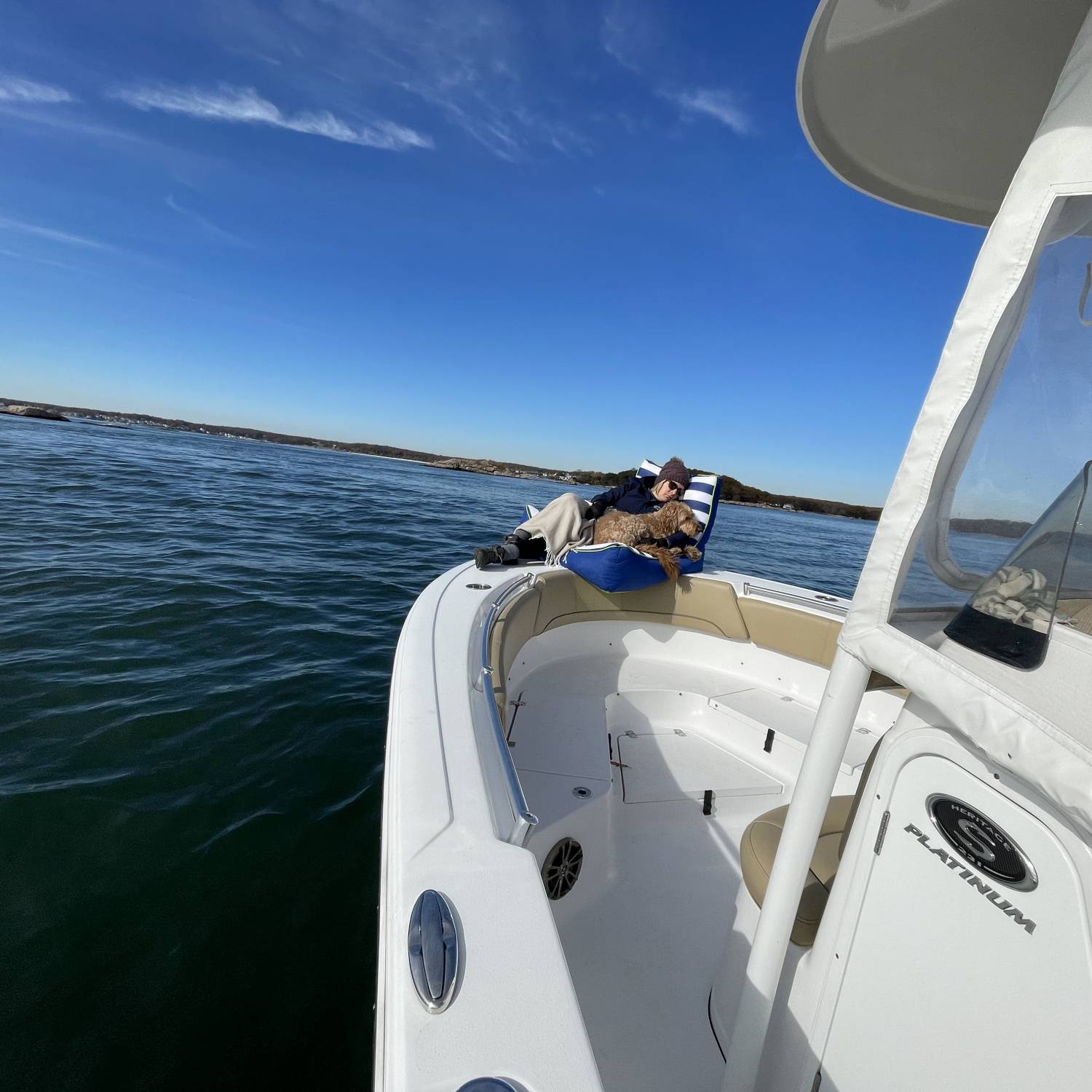 While the weather gets colder, we just bundle up and get out on the water! Wife and dog nap in...