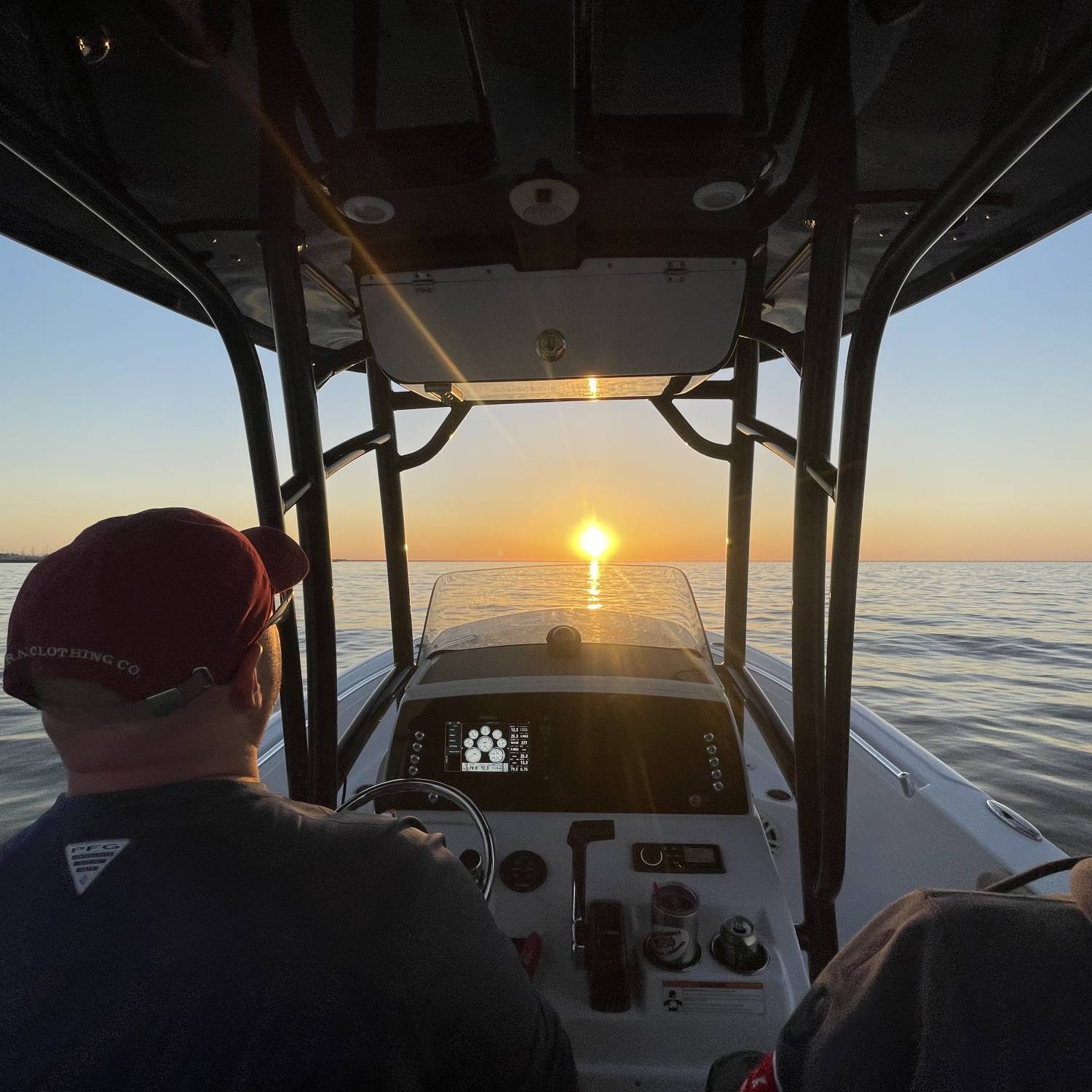 Title: Sunset in New Orleans. - On board their Sportsman Open 232 Center Console - Location: Lake Pontchartrain, New Orleans. Participating in the Photo Contest #SportsmanApril