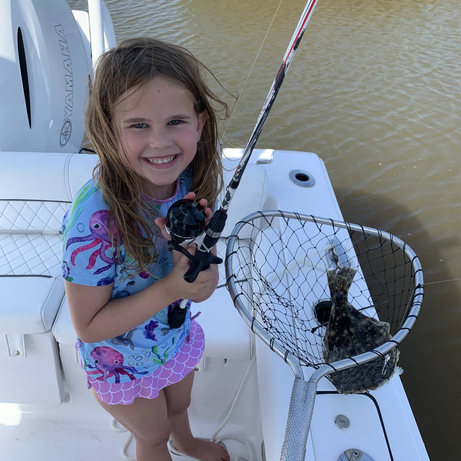 My girl’s first fish.  She started yelling I caught a flounder fish.  She loves to fish, crab a...