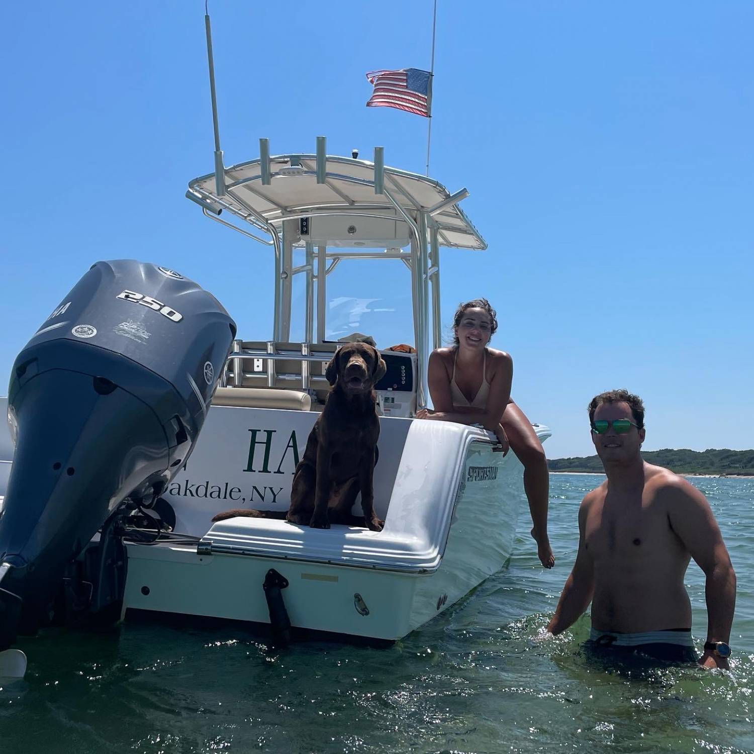 Title: Hanging with Levi dog on Shagwong Point - On board their Sportsman Open 232 Center Console - Location: Montauk, NY. Participating in the Photo Contest #SportsmanAugust