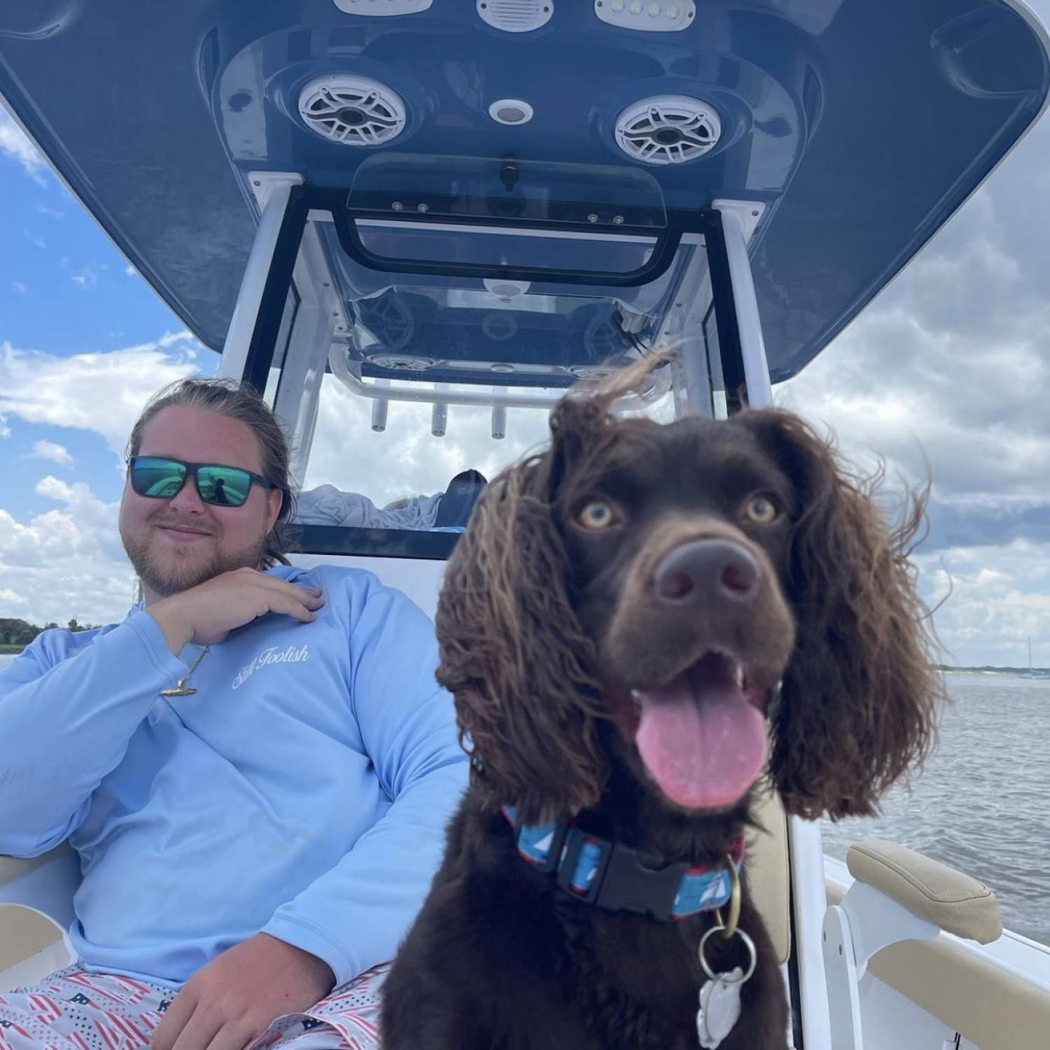 Title: Dog days - On board their Sportsman Masters 247OE Bay Boat - Location: Fernandina beach fl. Participating in the Photo Contest #SportsmanAugust