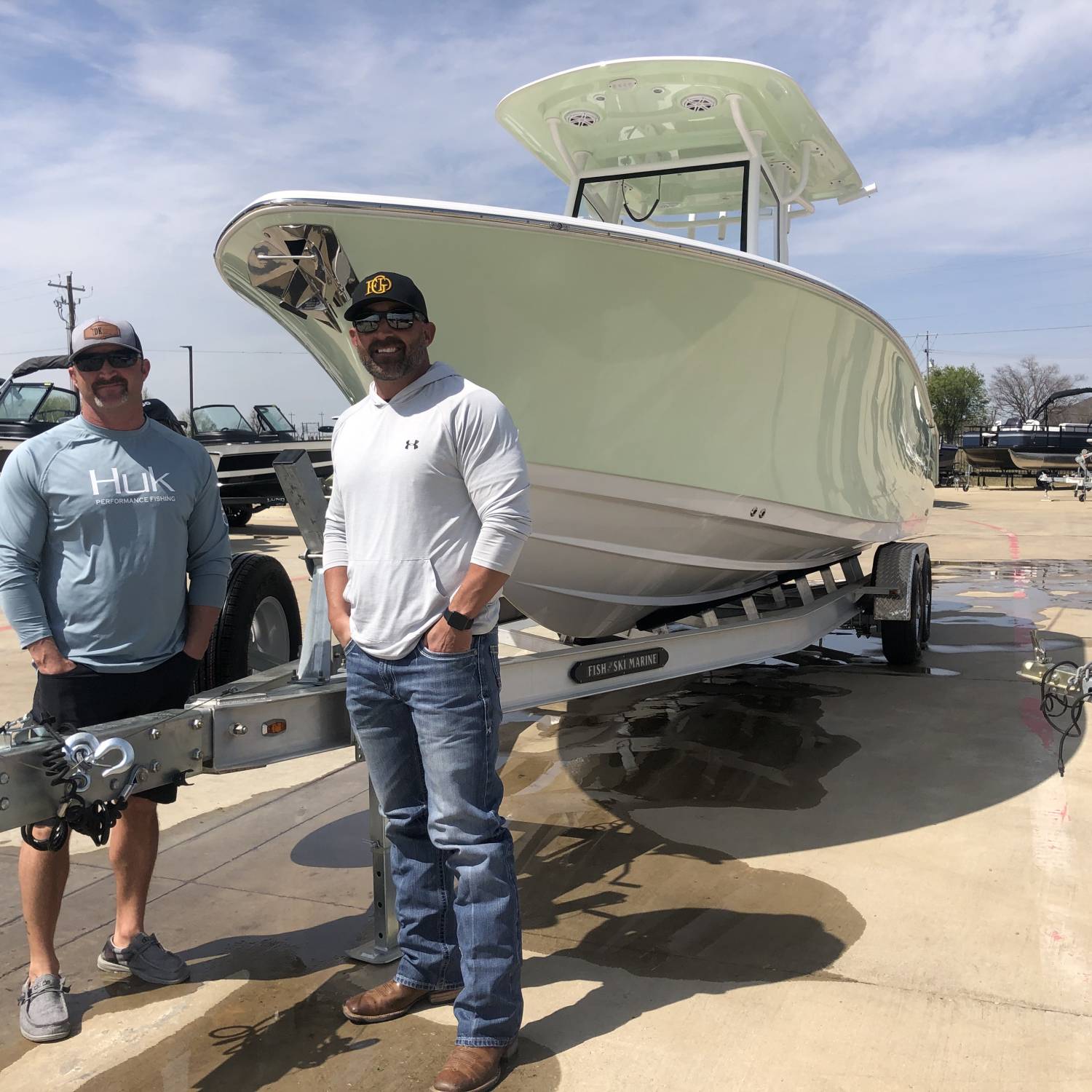 This is a photo of my brother and I prior to pulling the boat home from the dealer!