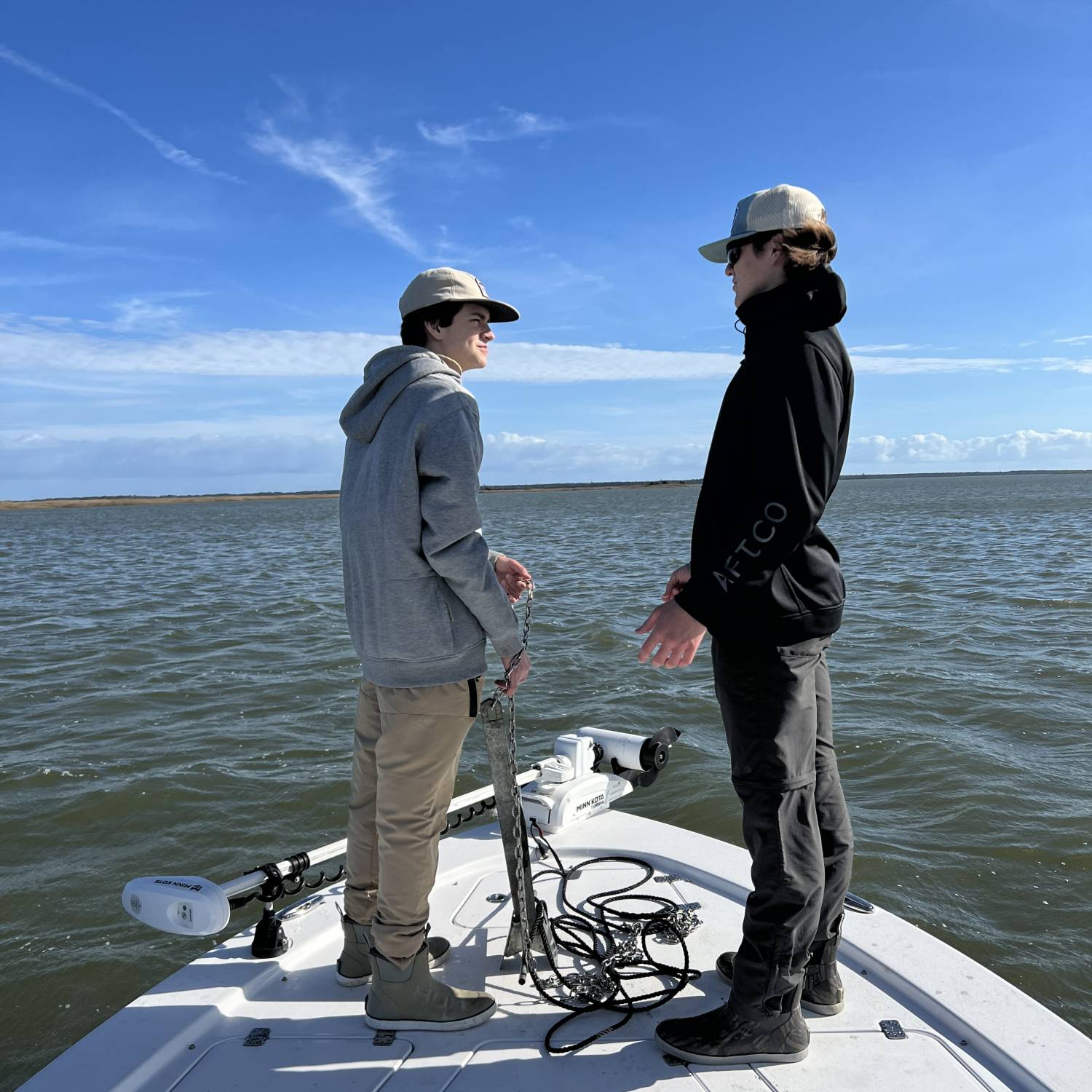 Title: Discussing strategies - On board their Sportsman Tournament 234 Bay Boat - Location: Santee Bay. Participating in the Photo Contest #SportsmanJanuary2022