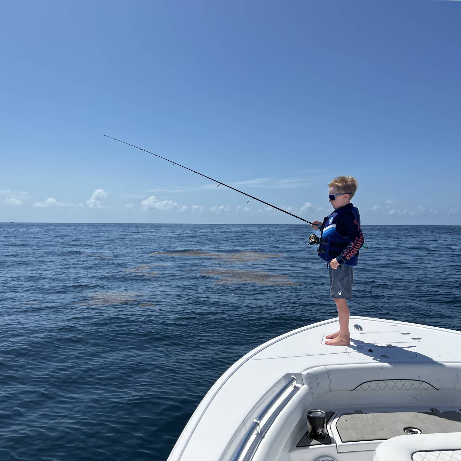 My six year old enjoying the weather, a weed line and sunshine on a beautiful day in the Atlantic Ocean!!