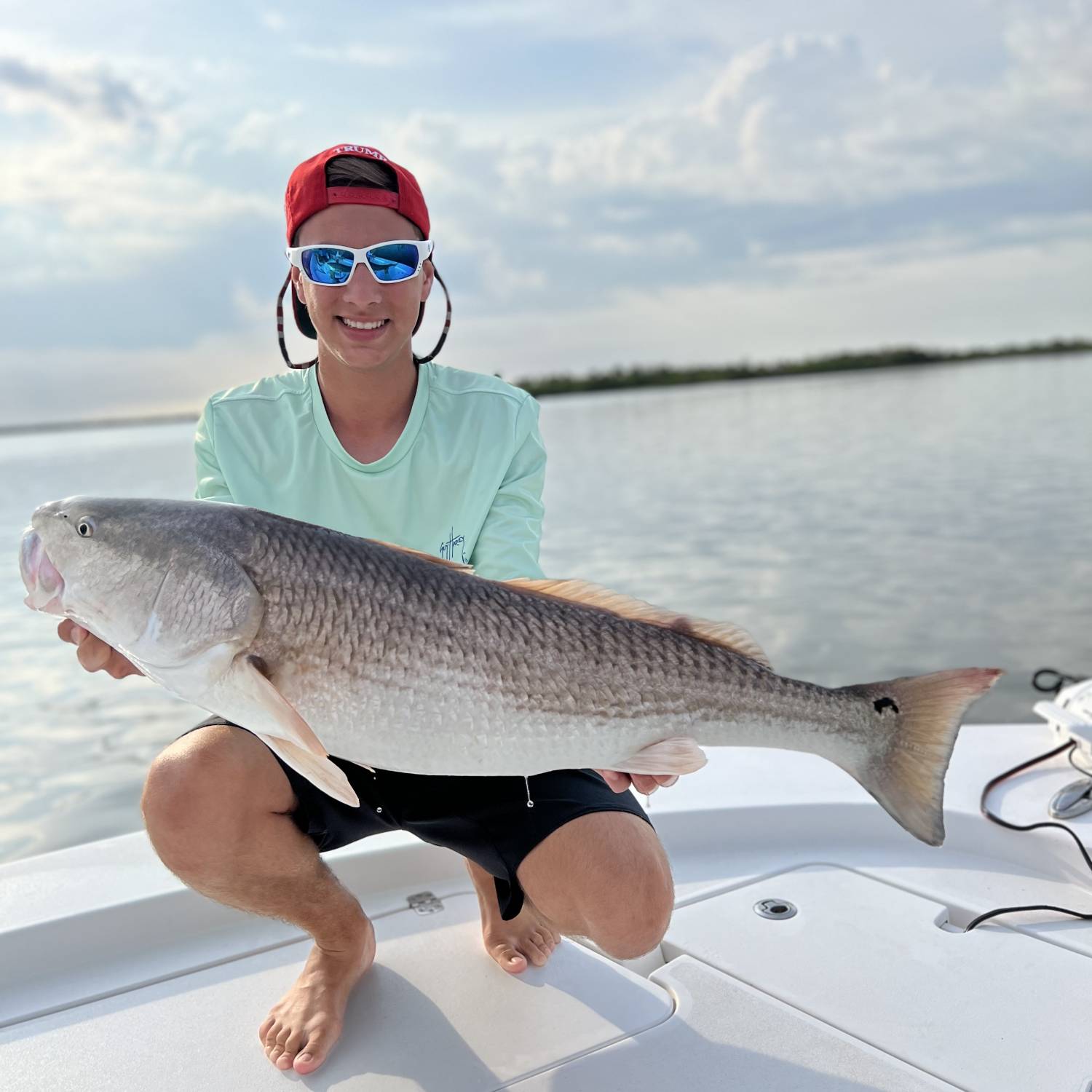 Title: RedFish weekend - On board their Sportsman Masters 247 Bay Boat - Location: Mosquito Lagoon. Participating in the Photo Contest #SportsmanJuly