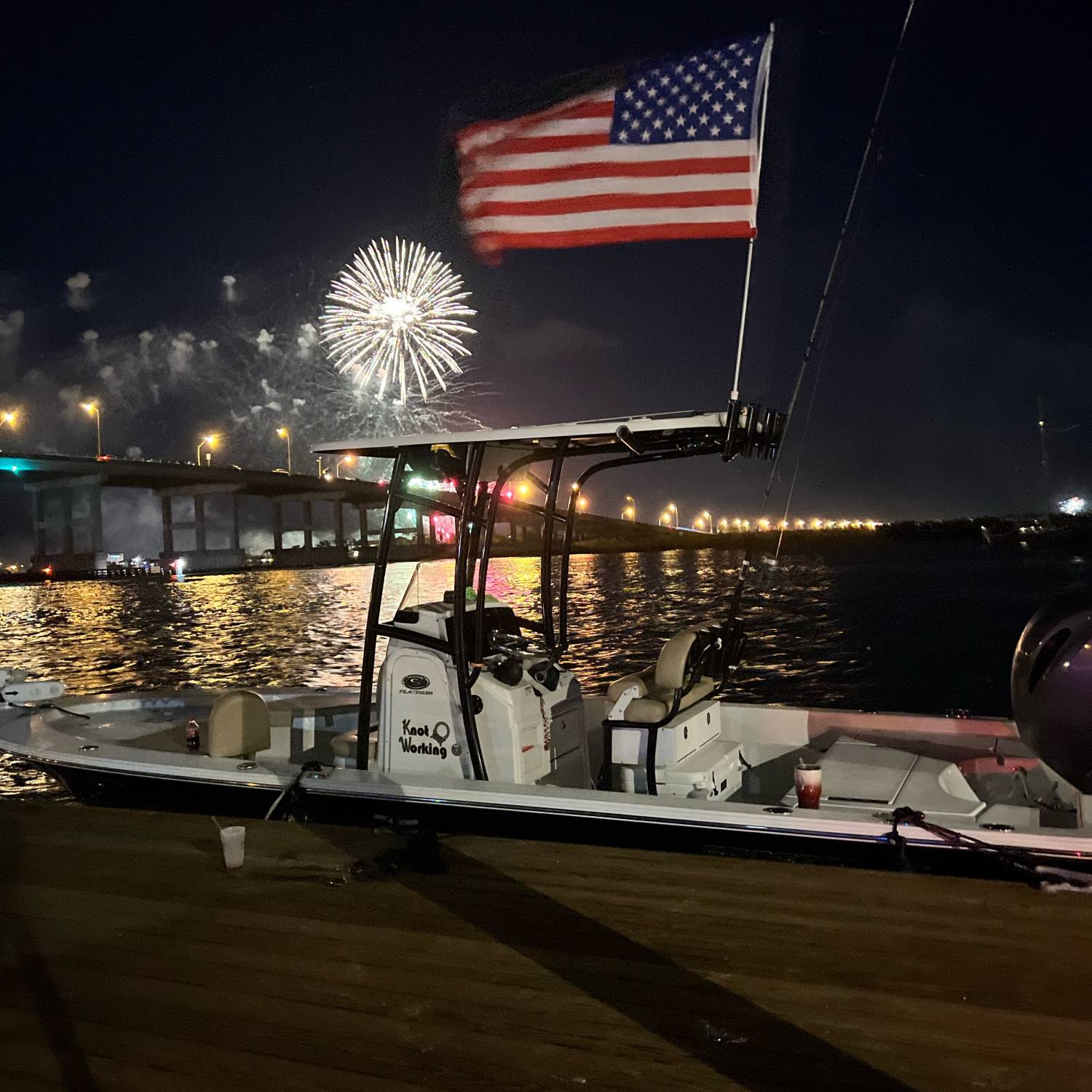 Our Sportsman at the dock with the Fireworks in the background.