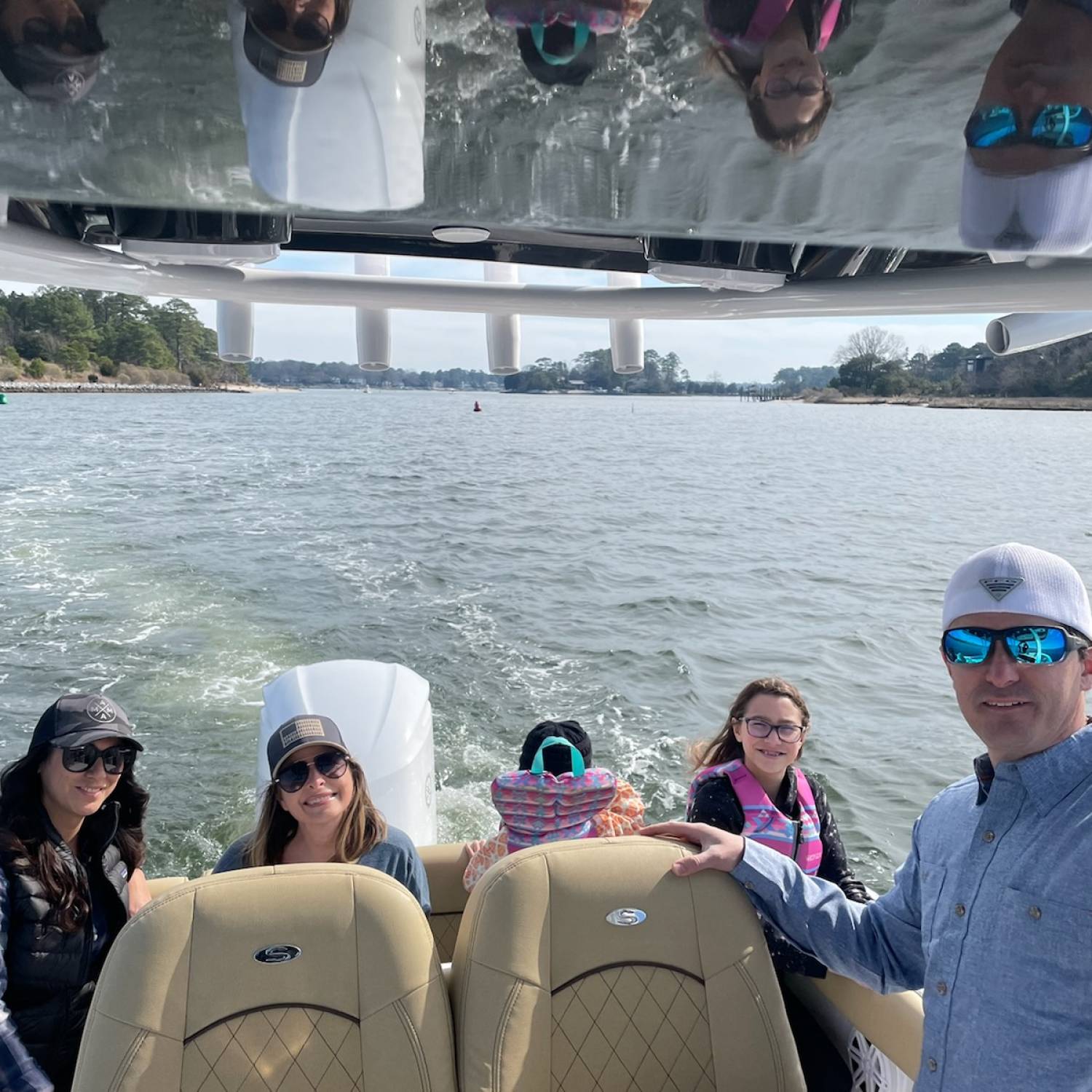 Title: Making the most of a warm winter day - On board their Sportsman Heritage 231 Center Console - Location: Virginia Beach VA. Participating in the Photo Contest #SportsmanMarch