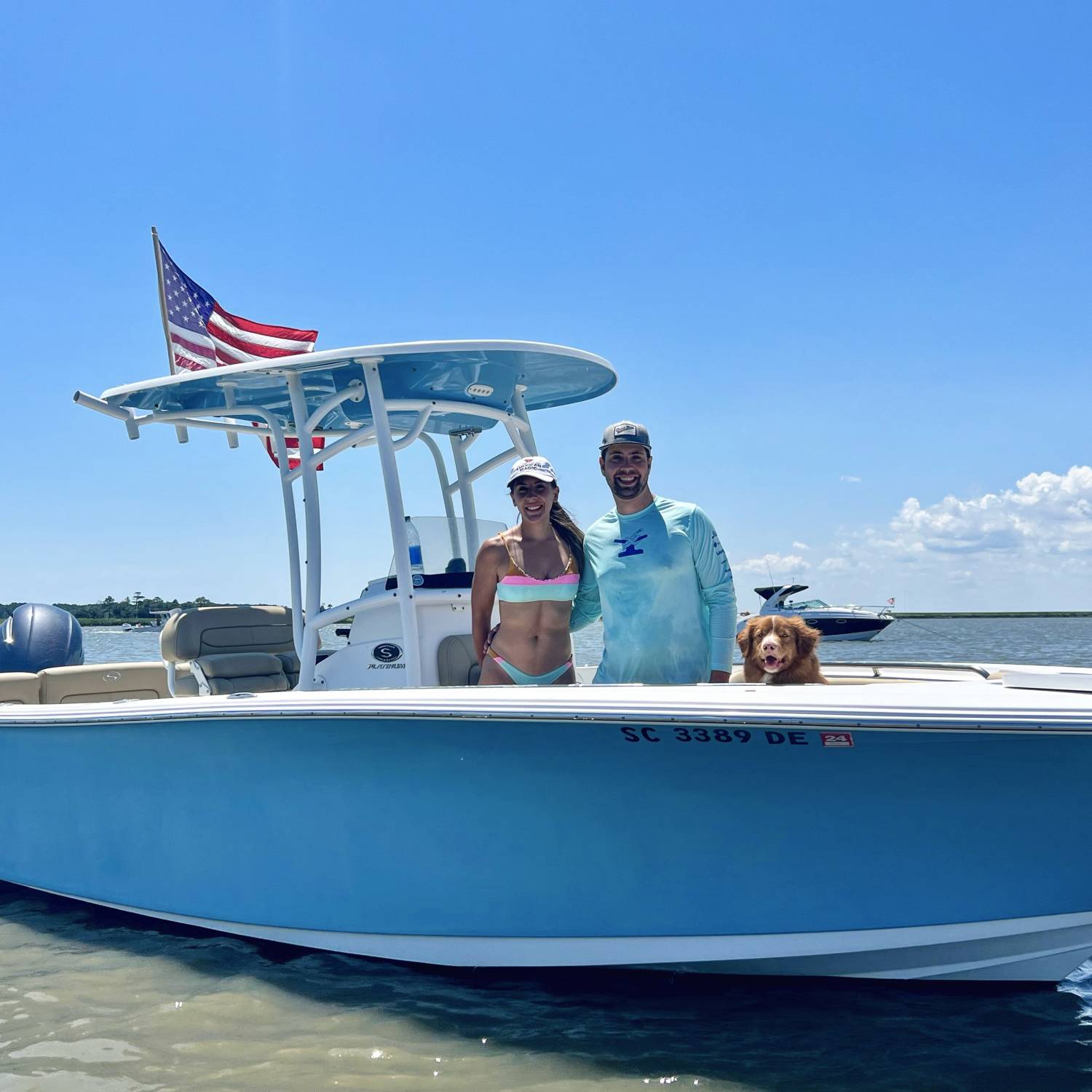 Photo of my family on the boat…including the pup!